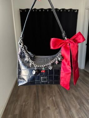 Dooney & Bourke Black Shoulder Bag with Red Bow and Charm Chain